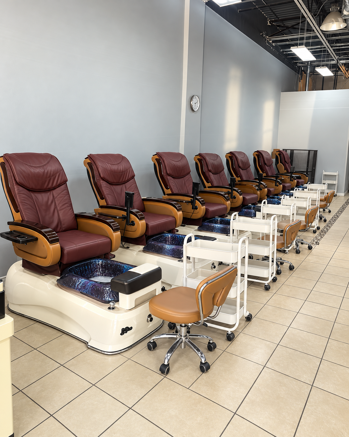 Empty pedicure chairs inside TN NAILS & SPA
